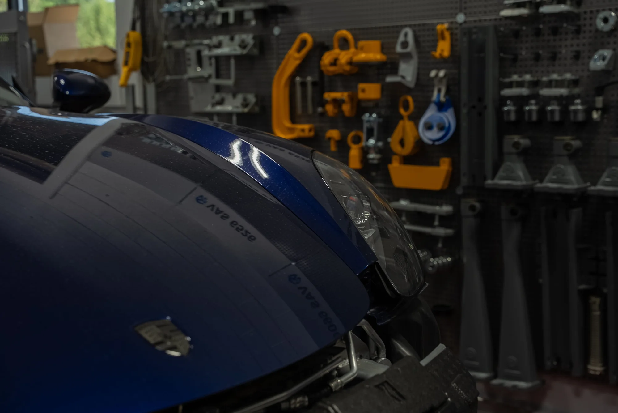 Vehicle front end and frame tooling inside the Body Builders Automotive repair bay