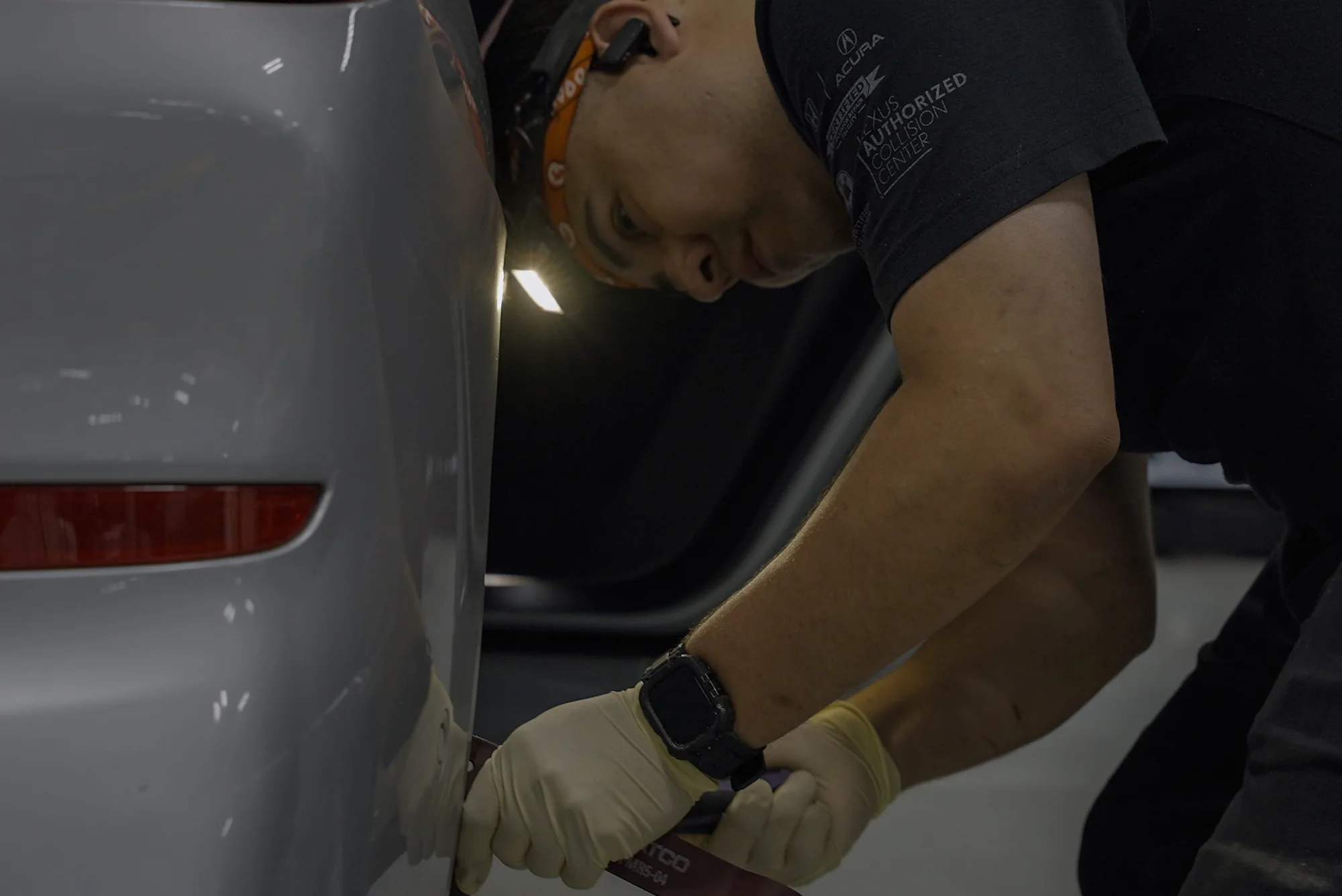 Close-up of panel finishing work at Body Builders Automotive